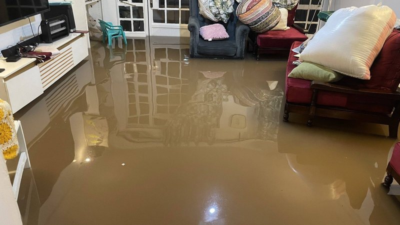 a submerged house following recent flooding. People living along Nairobi river have been warned following fears that the Nairobi dam could break its banks if the rains persist.